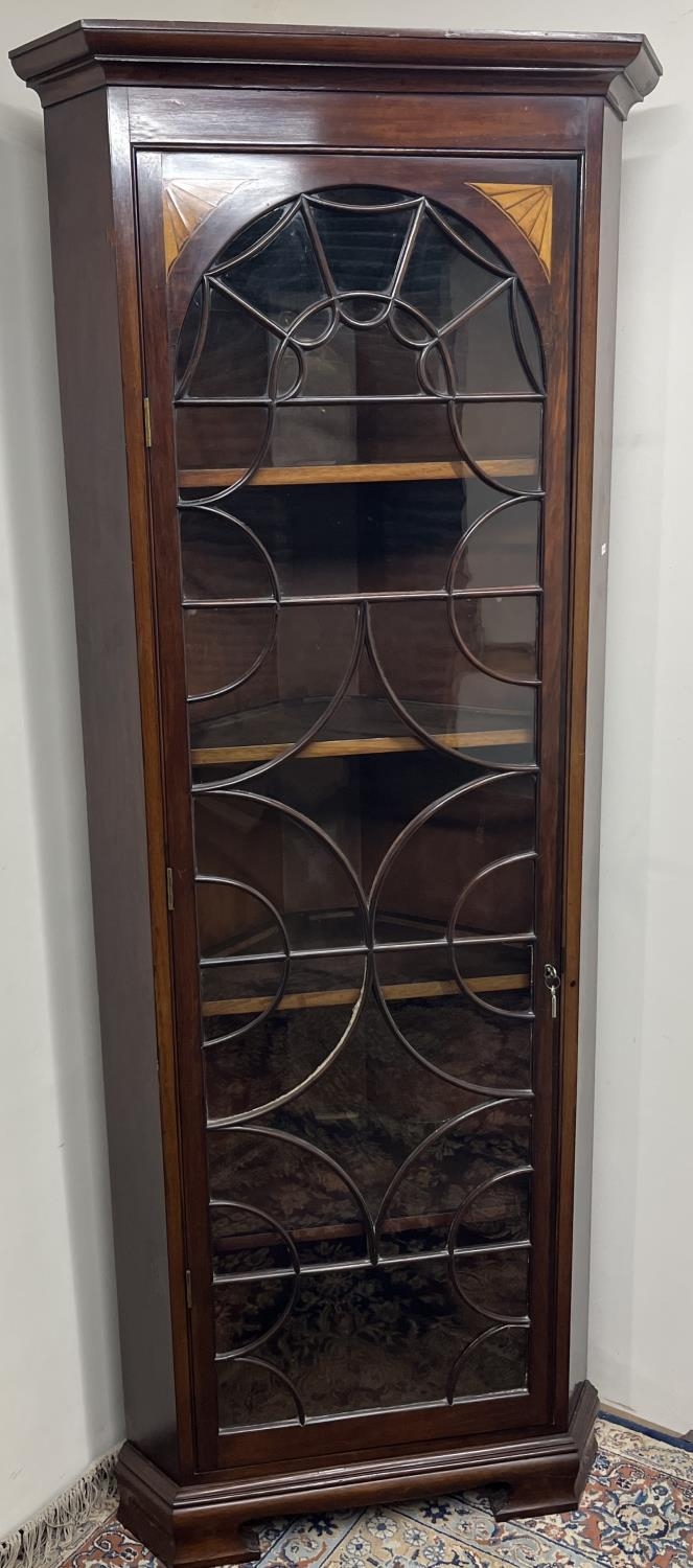 George III style mahogany corner cabinet with moulded cornice above astragal glazed door with