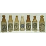 Collection of early 20th century stoneware ginger beer and stout bottles, predominantly North East