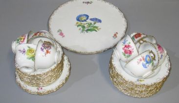 Meissen tea service, painted with wild flowers in gilt shell borders, comprising; eight trios, three