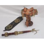 2 Chipperfields elephant brasses , Circus ceremonial elephant prodder and a small leather saddle