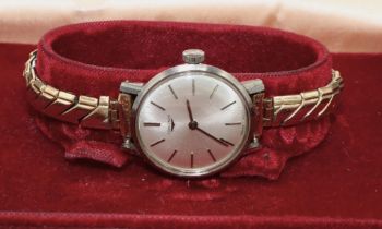Ladies stainless steel wristwatch, signed silvered sunburst dial with baton hours, signed crown,