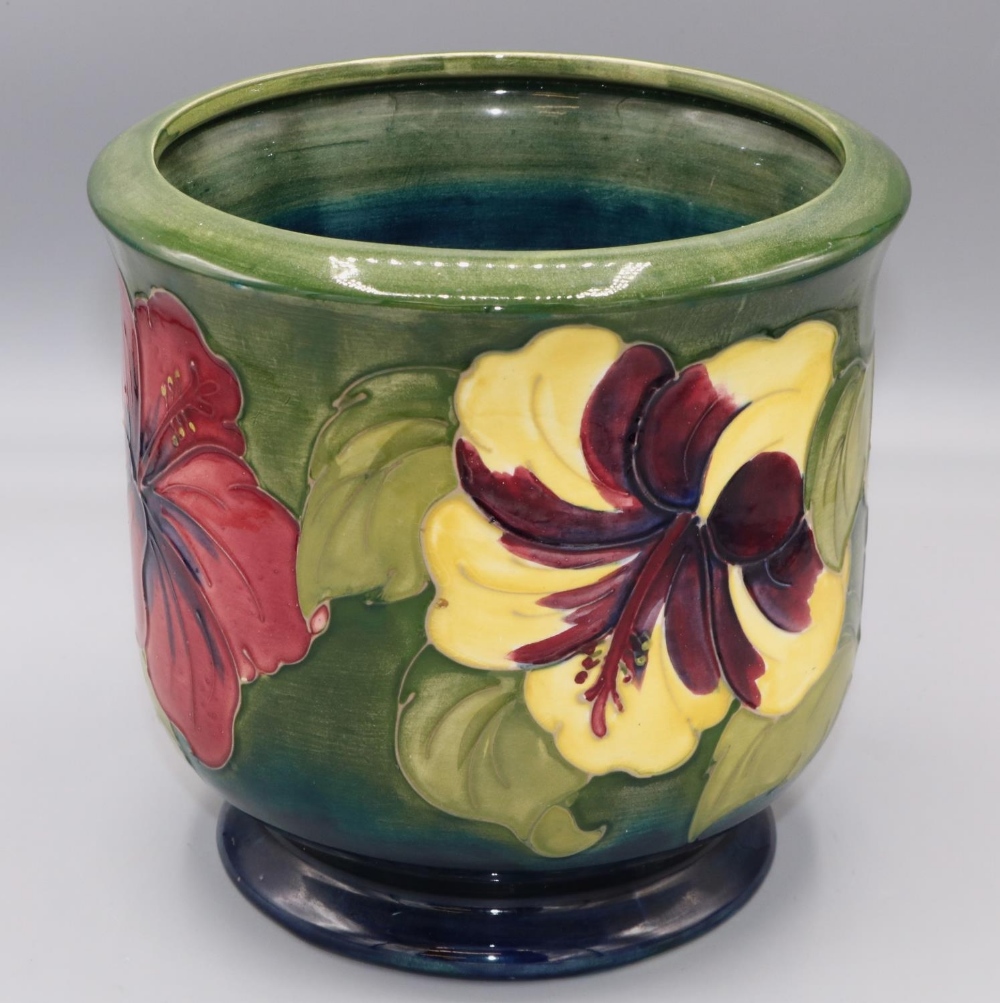 Moorcroft Pottery: 'Hibiscus' pattern cache pot, yellow and red flowers on graduated blue to green