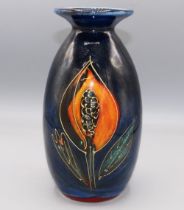 Anita Harris art pottery, minos vase, orange flowers on dark blue ground, H21cm