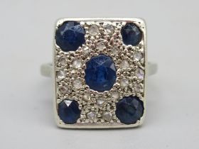 9ct white gold sapphire and diamond ring, the rectangular face set with central oval cut sapphire,