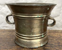 Large bronze mortar, banded bell-shaped body with two lug handles, H14cm W20cm max