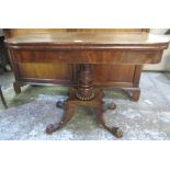 Regency mahogany tea table, folding top on vase turned column and platform base with four paw