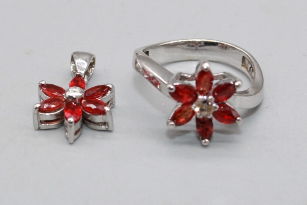 18ct white gold necklace set with diamond and ruby floral cluster ring, size M, and matching