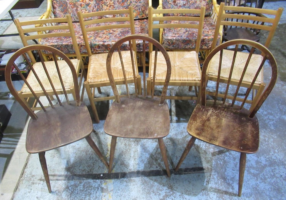 Set of four beech ladder back dining chairs with rush seats and a set of three vintage dark Ercol