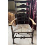 Early 19th century ash and elm Lancashire ladderback elbow chair, with shaped top rail, flattened