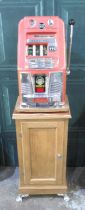 Sega-Bell One Arm Bandit Fruit Machine Slot Machine, H67.3cm W41cm D39.5cm, on a oak single door