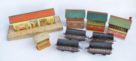 Collection of unboxed vintage Hornby Meccano O gauge lithographed tinplate buildings and 4 passenger