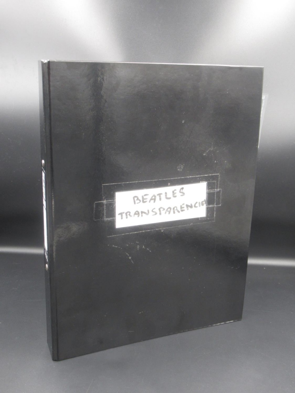Beatles - folder cont. 33 35mm plastic cased photo transparencies relating to the Beatles