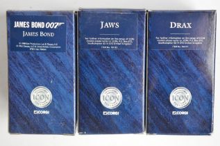 Three boxed Corgi James Bond diecast 1/24 scale Icon Figures to include James Bond, Jaws and Drax.