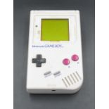 1989 Nintendo Gameboy, missing front panel, working at time of catalogue, with Super Mario Land Game
