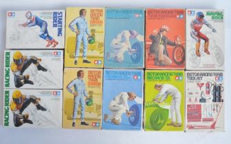 Eleven boxed 1/12 scale plastic racing car and motorcycle figure sets and accessory packs from