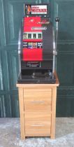 Money Matador One Armed Bandit Slot Machine, H82cm W48.5cm D45cm , in working order, on a oak 2