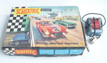 Vintage Scalextric Set 60 with extra early cars with working steering. Set A/F, box poor. Also