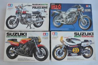 Four unbuilt 1/12 scale plastic model motorcycle kits from Tamiya to include 14009 Suzuki RGB500