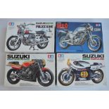 Four unbuilt 1/12 scale plastic model motorcycle kits from Tamiya to include 14009 Suzuki RGB500