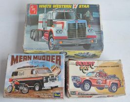 Three unbuilt 1/25 scale plastic model vehicles to include rare and long since discontinued late