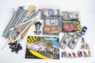 Collection of Scalextric cars and accessories to include 5 cased cars from Fly, Ninco, SCX and