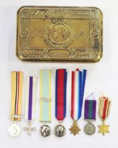 WWI Queen Mary Christmas tin containing collection of seven miniature medal with ribbons. 1914-15