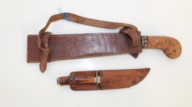 Indonesian Parang with wooden hilt and leather sheath. A small English hunting knife with antler