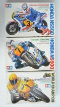 Three unbuilt 1/12 scale racing motorcycle plastic model kits with driver figures from Tamiya to