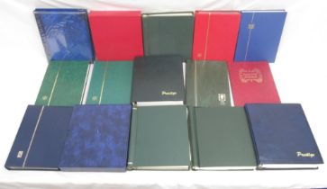 Assorted collection of International and British stamps in 15 folders/albums