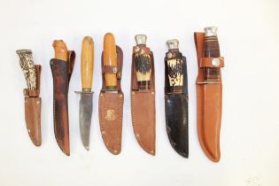 Collection of seven sheath knives of various styles, including a John Knowles of Sheffield