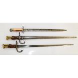 Two 1875 bayonets "Mre D'armes de St. Etienne", one with original scabbard. WW1 Lee Enfield