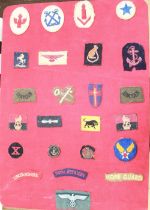 Boards containing collection of cloth badges. To include royal artillery, RAF, RAF Tropical,