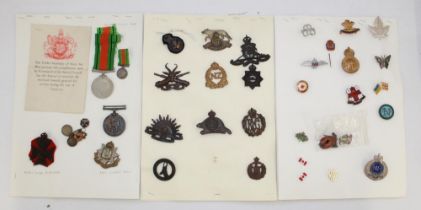 Collection of medals and badges, including a WW2 General Service Medal with miniature and