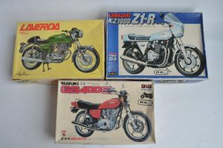 Three 1/8 scale motorcycle plastic model kits, (1 partially built up) to include Nagano Kawasaki