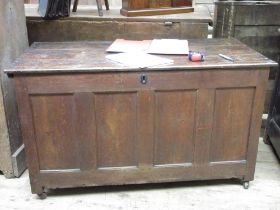 Late 18th century oak four panel coffer, with planked hinged lid and metal carry handles, W132cm