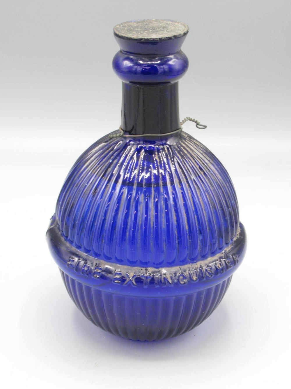 Victorian Hardens 'Star Hand Grenade' fire extinguisher, blue glass, with liquid contents, H17cm