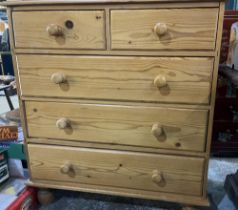 Waxed pine chest of two short and three long drawers, turned handles and feet, W91cm D47cm H100cm