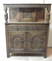 C20th oak Jacobean court cupboard, with carved drawers over two carved panel doors, W108cm D46cm