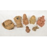Collection of terracotta clay antiquities from various civilizations, including a South American