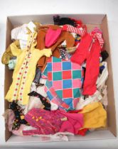 Large collection of dolls clothes including modern and vintage Sindy