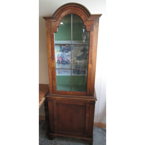 Queen Anne style walnut arched top side cabinet, with glazed upper and panel lower doors on bracket