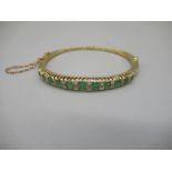 15ct yellow gold hinged bangle set with graduated emeralds cut emeralds and brilliant cut
