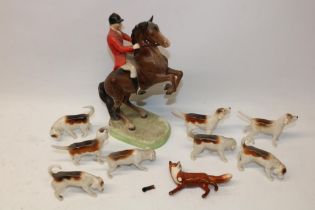 Beswick fox hunting group comprising Huntsman on rearing horse no. 868, H24cm; eight hounds and a