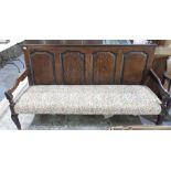 Geo. 111 oak settle, four panel back with upholstered seat on cabriole legs, W187cm D64cm H101cm