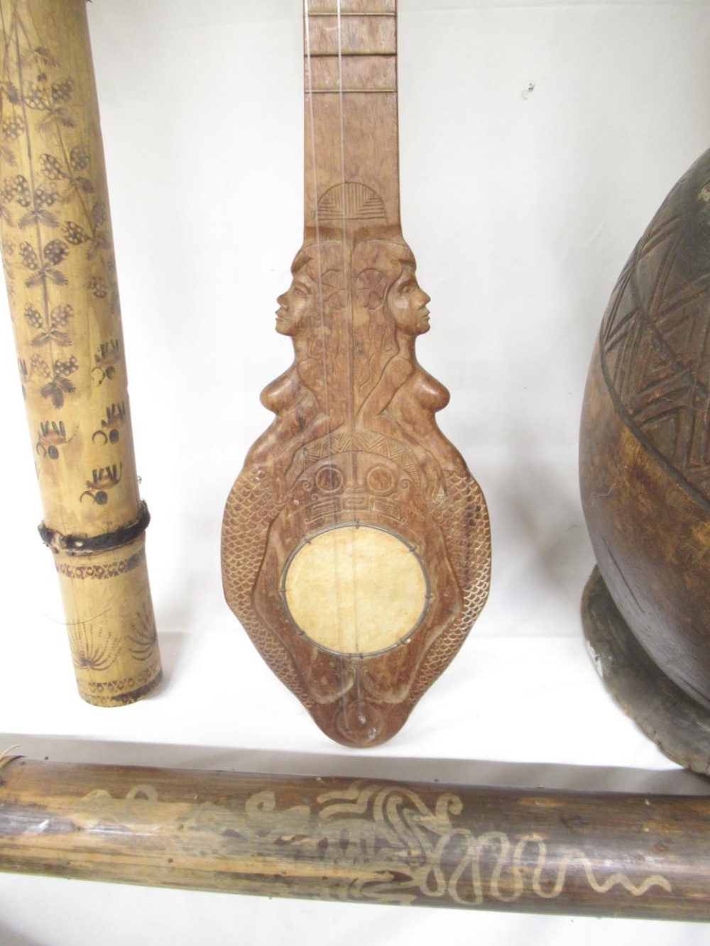 Carved didgeridoo with images of Kangaroo, Snakes, etc. carved wood 4-string instrument lacking 2 - Image 4 of 14