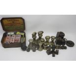 Four brass bell grocery weights; other brass grocery weights; cast iron grocery weights and