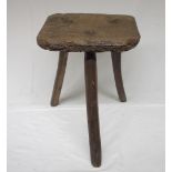 19th century Country made elm three leg low stool, shaped rectangular seat on three naturalistic