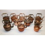 Twelve Victorian copper kettles all with acorn finials, H28.5cm (2)