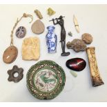 A large assortment of objects from various locations and time periods. To include a carved female