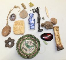 A large assortment of objects from various locations and time periods. To include a carved female